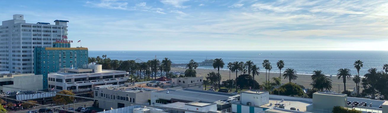 tall buildings along a beautiful sandy beach