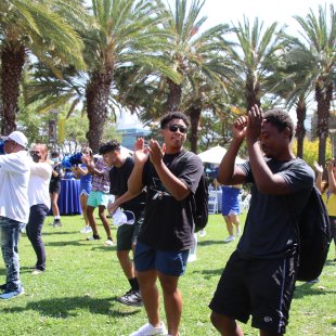 young people dancing and clapping