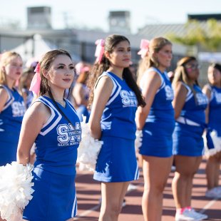 cheerleaders in blue uniforms