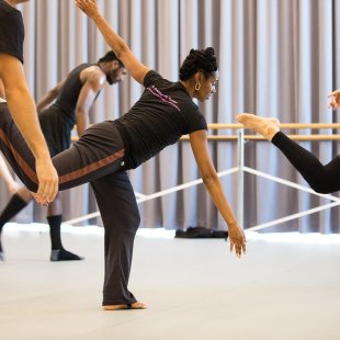 group of dancers in a studio