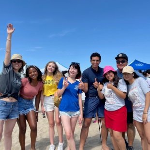 happy group of young people on the beach